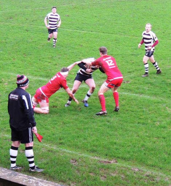 Brothers Scott (5) and Tom Powell (12) tackle well for The Scarlets